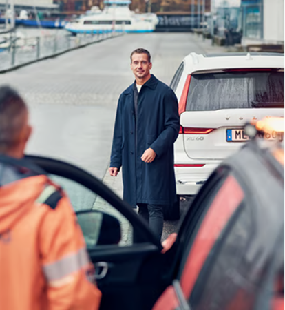 Volvo Approved Bodyshop technician greeting a customer